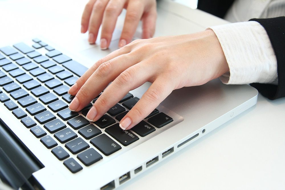 Under what conditions is it allowed to send commercial communications by electronic means in Spain?